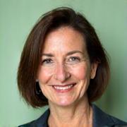 Professional headshot of Elara Vance, a warm and knowledgeable certified sleep consultant.